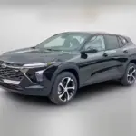 Front-left view of a black midsize SUV with a bold chrome grille and stylish alloy wheels.]**